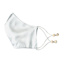 Load image into Gallery viewer, Ethical Kind Organic Peace Silk face mask with filter pockets, adjustable with eco-elastic cord and natural wood beads folded side view