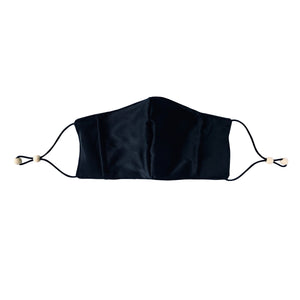 Ethical Kind Organic Peace Silk face mask with filter pockets, adjustable with eco-elastic cord and natural wood beads in black front view