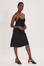 Load image into Gallery viewer, Ethical Kind Organic Peace Silk Slip Midi Dress in Black with adjustable cross back straps