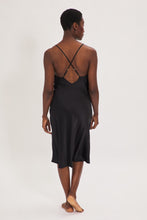 Load image into Gallery viewer, Ethical Kind Organic Peace Silk Slip Midi Night Dress in Black with adjustable cross back straps.