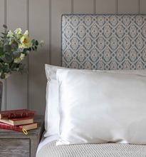 Load image into Gallery viewer, Ivory Organic Peace Silk pillowcase styled on a luxury bed by Ethical Kind.