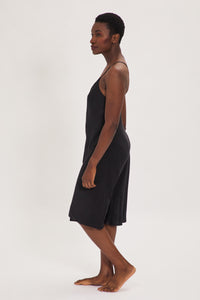 Ethical Kind Organic Peace Silk Slip Midi Night Dress in Black with adjustable cross back straps.